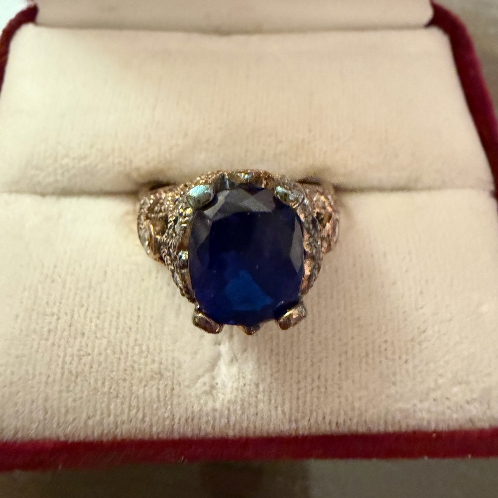 Elegant Faux Sapphire Blue Ring with Ornate Patina Goldtone Band and CZ’s.